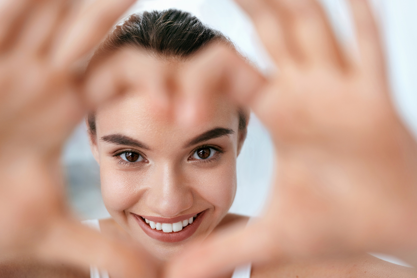 Eye Health. Beautiful Woman Face With Heart Shaped Hands. Beauty